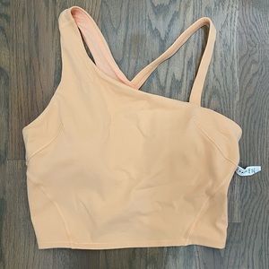 EVERLUX Asymmetrical Tennis Tank top in summer glow.